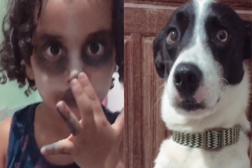 criança maquiada e cão