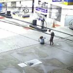 homem e mulher em posto de gasolina