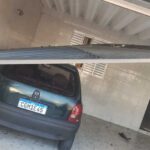 carro batido na garagem