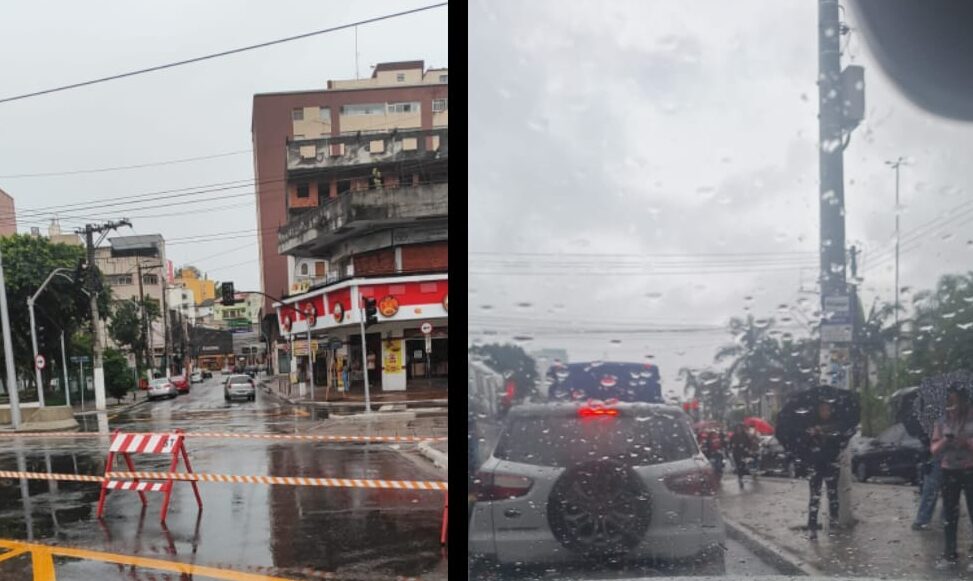 via bloqueada e pessoas na chuva, em São Bernardo