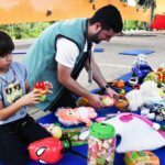 Semasa realiza Feira de Troca de Brinquedos neste domingo no Parque Central
