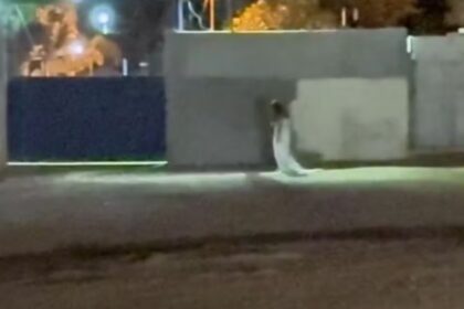 Mistério: Mulher vestida de noiva em frente a cemitério em GO intriga e viraliza